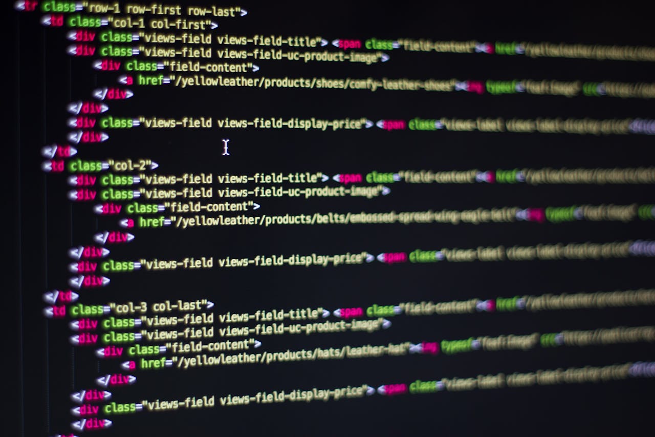 about-04 Detailed close-up of HTML code on a computer monitor, showcasing web development.